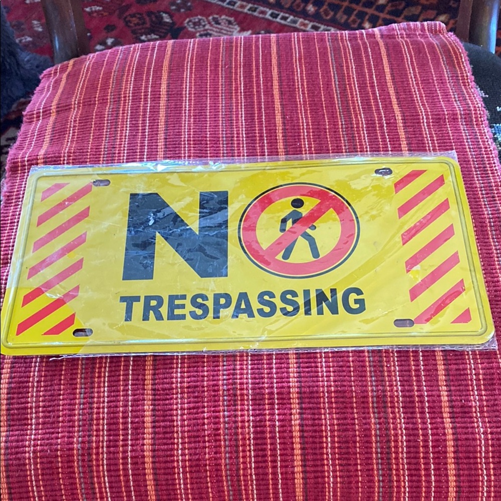 Yellow/Red No Trespassing Sign